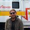 Alex Chambers with company van