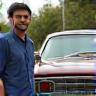 Rahul D. by his classic car